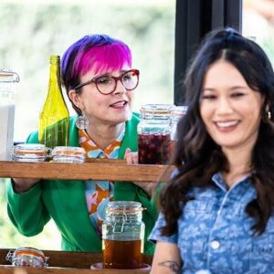 Cal Wilson Instagram - Me looking exactly the cat when he’s locked out of the kitchen. 

Dessert week on @bakeoffau tonight and it’s another corker! 
And it’s literally on in half an hour because I forgot to press post about 5 hours ago..
Catch it 8.30 on @foxtelaustralia and @binge 

#GABO #BakeOff #DessertWeek 

(Image. The beautiful Bake Off shed. @natalie.tran is laughing like she doesn’t have a care in the world, while Cal is trapped behind a set of shelves, looking plaintively at something just off camera, odds on it’s a delicious desserty thing she doesn’t deserve)