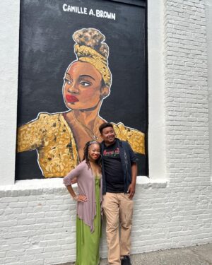 Camille A. Brown Instagram - I have always been proud to represent Southeast Jamaica, Queens, New York! “Queens is in da buildin!!!’” A very special thank you to  @jamaicaartscenter for including me in this series and for this massive acknowledgment! Many thanks to JCAL's Executive Director, Leonard Jacobs, JCAL's Artistic Director, Courtney Ffrench , NYC Parks Department Senior Public Art Coordinator, Elizabeth Masella, and Wendy A. Berot. Council Member, Nantasha Williams, District Leader and former Council Member, I. Daneek Miller, NYC Parks Queens Borough Commissioner, Michael Dockett

I am very honored to be on the wall with LL COOL J, Sweet Tee, Q-Tip, Jackie Robinson, Gregg Vance (Coach Chuck), Lani Guinier, W. E. B Du Bois, Naomi Osaka, and Count Basie! 

And shout out to the super talented artists who created the murals: 

Eric Black 
Justice Levenson 
Tyler Blau (LAG!) 
Nicole Wang 

Original pic by @josefinasantos 

Shout out to my family and dance family who came out to support! 

I was asked what was my hope when Black youth look at this mural. That all things are possible and to BELIEVE!!! There will always be challenges, but keep living your dreams, shoot for the universe, and be yourself in all spaces.

If you’re ever in Jamaica, Queens stop by Daniel O'Connell Playground and check out
#queensreflections 

Gratitude!