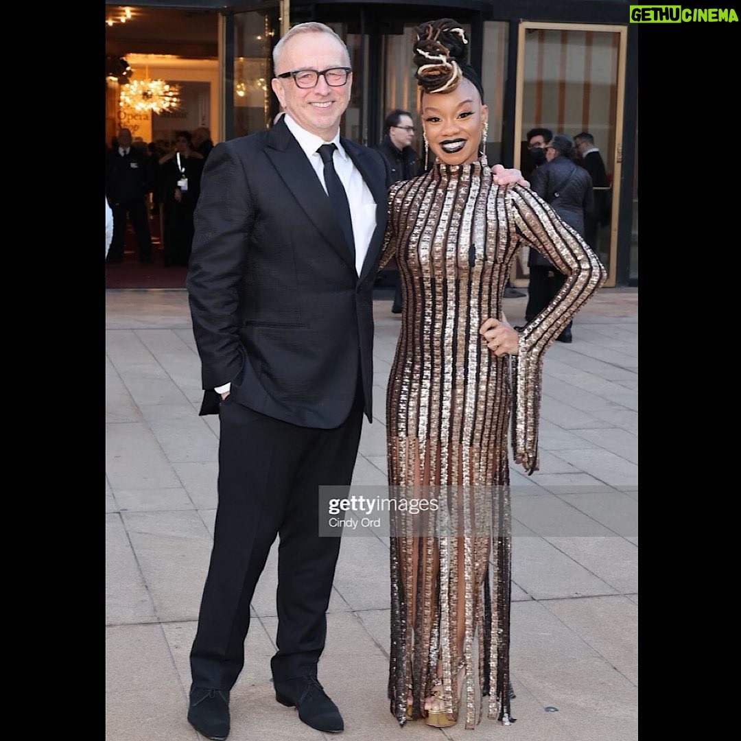 Camille A. Brown - 2.1K Likes - #FBF We opened @terence_blanchard Champion at @metopera on Monday! I am very honored to return to The Met for my 3rd opera! Porgy & Bess (2019), Fire Shut Up In My Bones co-directed with James Robinson (2021) and now Champion (2023). I went to high school across the street @lagalumniandfriends (LAG!) and never imagined that my work would be shown on The Met stage! I am very honored and thankful for the opportunity to delve into the world of opera. A very special thank you to Peter Gelb and James Robinson for inviting me to be a part of The Met family. Thank you to Peter and Dodie Kazanjian (Director of Gallery Met) for hanging my portrait (by @drillboney Jim McKeon) in the Founders Hall! Check it out when you come to the show!!! Thank you James Robinson and Terence Blanchard for your spirit and encouraging words throughout the process! Itās always a pleasure being in the room with you both! Thank you for believing in me! Shouting out @rickeytripp (Associate Choreographer) and @maleek_washington (Assistant Choreographer) to the rafters!!! Thank you for your love, support, and teamwork. Love you both so much. Congratulations to the creative team, @metoperachorus @metoperaballet @metoperaactors @metoperastagemanagers and everyone who contributed to this show.
My grandma used to listen to operas on the radio. It was one of her favorite things to do. Every time I step into The Met building I think of her and the love she had for the art form. Lifting up my grandma today and always. Champion runs until May 13th! Check out the HD performance on April 29th!
Styled by @jakesokoloff
Make up by @harristevenb
Dress: Aggi (@aggi_pl)
Shoes: Alexandre Birman (@alexandrebirman)
Earrings: Elizabeth Cole (@elizabethcolejewelry)
Photos 1-3 by @gettyimages
4 and 5 by @olivier.medus
6-10 Ken Howard/The Met Opera