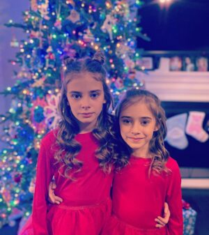 Carina Battrick Instagram - Christmas is surrounded by love, joy, and hope. Pass along this message to everyone to spread the light of this wonderful holiday.

#holiday #sisters  #christmastree #model #ralphlauren #happyholidays  #adorable #cutenessoverload #igkids #fashion #holidayfashion #style #stylishtrends #stylekids #pattern #red #brunette #blondehair #styletrends #fashionkids #kidsholiday  #stripes #santa #gifts #happyholidays #christmas2022 #holidaymagic #love #sisterlove #christmasdress #christmas