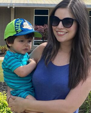 Carlee Baker Instagram - He loves the library. He’s still on the fence about the hat. 📚🧢