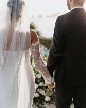 Cassie DiLaura Instagram - got my wedding photos back…incoming!!! 💍 
oh and it’s #valentinesday ❣️

HVD to my husband 🤭 aka my forever #valentine because you’re legally stuck with me now 😘 I love walking through life with you ILY 🥰

@photobyjulieta 
@thecapehotel 
@annettamcbain 
@dolceglow x @isabelalysa 
@blushnroses.cabo 
@cabocelebrations 
@alouisebridal 

#happyvalentinesday #newlyweds #wedding #bride #groom #husband #thecape #cabo #weddingphotos #weddingphotography #weddingvenue #mexico #cabosanlucas #dippedindolce #sleevesdress #lacedress #floraldress #weddingdress #weddingdressinspo #weddingdressinspiration #weddinginspiration #weddingdecor