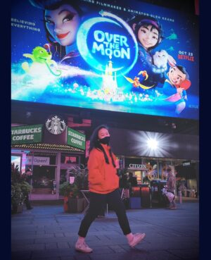 Cathy Ang Instagram - 3: Just cruisin’ through Times Square... 😏
.
(me pretending to be cool but actually screaming because WE’RE ON A FREAKING BILLBOARD 😅)
.
Over the Moon launches this Friday, October 23rd on Netflix 🚀
.
pc: @sangstagrams and @kanellacoconut 
#overthemoon #overthemoonmovie #netflix #glenkeane #pearlstudio #netflixfilm #timessquare #billboard #himom #asian #asianrepresentation #nyc