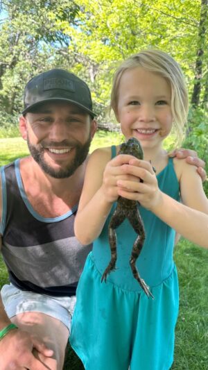 Chad Mendes Instagram - She’s been sneaking around the pond for two hours trying her hardest to catch a bullfrog lol. I hear a splash, look up and she’s running my way with both hands grabbing this guy, smiling from ear to ear!! lol. God I love this little woman…..😂😍🙏🏼

#daddysgirl #huntress #nonstop #bullfrog #success