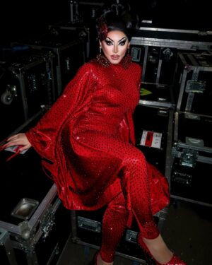 Cherry Valentine Instagram - Red-e for the stage! 🍒

Casual dance number for the @dragraceukbbc @vossevents tour ♥️ falling in love with the stage every night! 🔥

Look by @coquetryclothing stoned by myself… & @lawrencechaney (thx gurl) ✨
Hair by @mannhandledwigs 
📸 by @billyroysawyer
