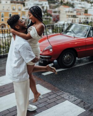 Cheryl Des Vignes Instagram - Saying some player shit to a girl I always wanted 🏁

Two weeks in Italy at the beginning of May also marks 1 year of our engagement. Decided we couldn’t go to a place as beautiful as the Amalfi Coast and not celebrate by finally taking engagement photos. Somehow we got down to these 10, but we’ve been staring at all 90 since we got them back lol. Maybe we’ll go through them all on YouTube 🤔

📸: @amalfitana_photographer 
🏎️: @spiderlifestyle
