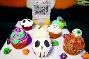 Chester Rushing Instagram - @miiumaux created stunning “Fright Krewe” inspired Cupcakes & we saved You one!🧁 We hope everyone is enjoying the new show, Happy Spooky Season!! 
Thank you @dreamworkstv for the cool shirts love em’ !💚👁️💀✨🧟‍♂️ #frightkrewe #cupcakes #desert #october