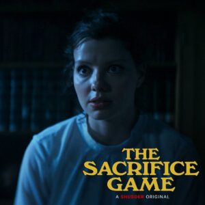 Chloë Levine Instagram - What am I looking at?! What’s going on?! Find out this Friday when The Sacrifice Game comes to @shudder 🩸🎄😈