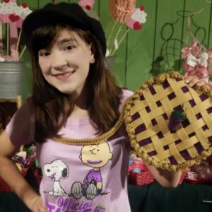 Chloe Noelle Instagram - Happy Pi Day! I wanted to post a pic with my favorite boysenberry pie and I found one of me and a @missdoolittles Boysenberry Pie Purse! The pie that never ends! 
💜🫓🍇💜🫓🍇💜🫓🍇💜🫓🍇💜
.
.
.
.
.
#happypiday #picayune #314 #knottsberryfarm #knotts #boysenberrypie #chloeirl #chloenoelle #actress #influencer #contentcreator