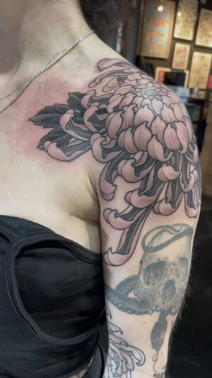 Chris Garver Instagram - Did this one a little fancier than I usually do to match up with some beautiful flowers on Eva’s lower arm done by the  great @joaoboscoart 

#flowertattoo #flowertattoos  #blackandgreytattoo #blackandgreytattoos  #kiku #crysanthemumtattoo  #crysanthemum