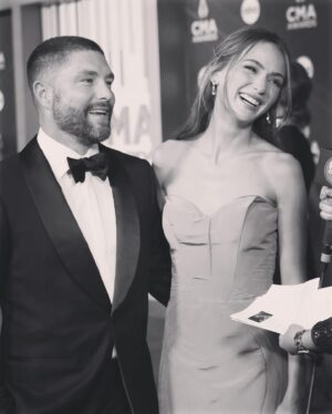 Chris Lane Instagram - Mom & Dad date night at the @cma

Stylist - @kristaroser
Assitant - @clairetjohnson 
LL Tailor - @stefanienaylor
CL Tailor -  @jbcustomtailoring
Suit   Cufflinks - @michaelandrewsbespoke
Shoes - @aldo_shoes 
Bowtie - @brooksbrothers 
Watch - @rolex
Gown - @zacposen / @janetmandell
Heels - @paulandrew 
Bag - @jeffreylevinson 
Earrings - @kingjewelers