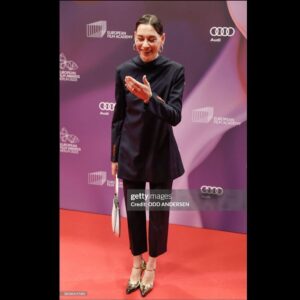 Christiane Paul Instagram - #about #yesterday @europeanfilmacademy #awards
#congrats to all the #winners!!! Especially to the fantastic #sandrahüller !
.
.
#thanks to @andreaspeterkrings for #styling but most of all #guiding me!🧡
#thanks for the #glam by @philippverheyen 💫
.
@acnestudios @prada #jewelry @sophiebuhai 
@gettyimages @imago.images