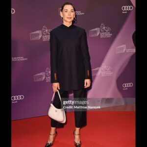Christiane Paul Instagram - #about #yesterday @europeanfilmacademy #awards
#congrats to all the #winners!!! Especially to the fantastic #sandrahüller !
.
.
#thanks to @andreaspeterkrings for #styling but most of all #guiding me!🧡
#thanks for the #glam by @philippverheyen 💫
.
@acnestudios @prada #jewelry @sophiebuhai 
@gettyimages @imago.images