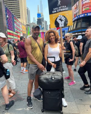 Chrystee Pharris Instagram - Y’all thought I was playing?! NYC Time Square picket line with my carry-on luggage! Got off the plane & went to the picket line. Pay us. #sagaftrastrong Thanks Richard E. Waits for hanging with me! 
•
•

•
•
#acting #actingclass #actinglife #actingtips #actor #actorproblems #actors #actorslife #actress #AtlantaActors #audition #auditioning #auditions #cast #casting #castingdirector #Hollywood #HollywoodActress #Hollywoodlife #blackgirlmagic #blackgirlsrock #keytosuccess #behindtgescenes #blackactors #lightscameraaction
#thespian #voiceactor  #voiceover #workingactor