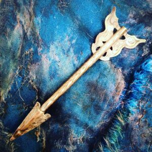 Colleen Atwood Instagram - Antique Arrow pin from Scotland sitting on the Mad Hatter coat from Tim Burton’s “Alice in Wonderland “ #timburton #johnnydepp #madhatter #aliceinwonderland #antiquejewelry #costumedesigners #silverarrow