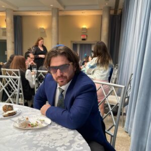 Dan Harmon Instagram - Bro in law and fellow gentile spy @danvidetich helping me make yarmulkes look rugged at Cody’s cousin’s kid’s bar mitzvah. This isn’t the party part. Just the coffee part after the official holy part. Never seen anything like that ceremony. Pure chaos. Cantor took a piece of candy to the head. Rabbi is a big Community fan but can’t be photographed until sundown or he’ll turn into a wolf (I think I’m getting that right). Little Maya with Aunt Cody. Now time to rest so we can drink a hundred tweens under the table. Shabbat Shalom Ross and Zac thanks for inviting us