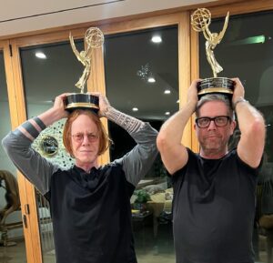 Danny Elfman Instagram - Fellow composer @johnj_powell and I spent ages trying to figure out how our new Emmys work. We couldn’t find any Bluetooth or USB connections anywhere on them… fact is we couldn’t even find the on/off switches! We finally determined that they make lovely hats.

#Wednesday #StillAMichaelJFoxMovie #Emmys @wednesdaynetflix