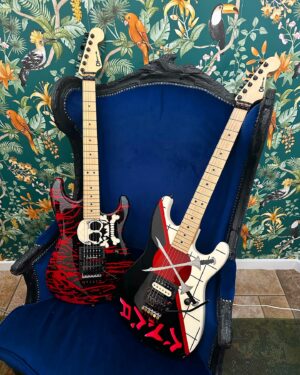 Dave Hill Instagram - Gratuitous photo of my buddy @thebeaujour’s @charvelusa Warrren Demartini skull guitar and my @charvelusa Warren Demartini swords guitar. Which is cooler?! #axelords