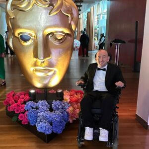David Holmes Instagram - The BAFTAs last night was a fun adventure. My documentary was nominated but unfortunately didn’t win. I want to congratulate Ellie Simmonds and her team for the well deserved win and also say congrats to every one at the event. It's still unacceptable that I was the only stunt performer in the room and if I’d of won I’d have said something on stage about my department being overlooked. 

Honestly it was fun but unless BAFTA starts recognising stunts I wouldn’t do it again. I didn’t see any other department members who were willing to risk their lives and bodies for the sake of storytelling and I just sat in a room too cold for a quadriplegic surrounded by people from a whole industry who don’t think stunt performers deserve a category.

 #StuntsForBafta  #Bafta #Quadriplegic #NoArmsLegsAnNoVoice #PenguinOnWheels
