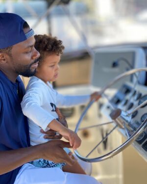 Derek Luke Instagram - My Son/day! My son is so unfiltered. We visited a yacht 🛥 club and were trying to fit in lol. He called me out with fun, hugs, & kisses 😂

I’m learning the point of having things is to enjoy them!!!!