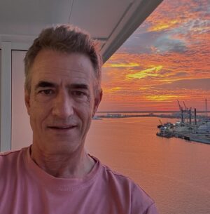 Dermot Mulroney Instagram - man at work on board 🚢  @royalcaribbean @utopiaoftheseasofficial sunset over the launchpads 🚀 @ Port Canaveral Florida #perfectlyimperfect