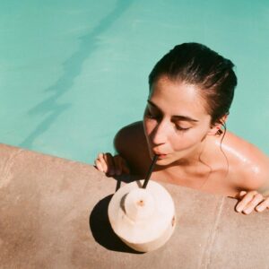 Dilan Gwyn Instagram - Throwback to pre-rona when my sister treated me to a weekend in Palm Springs and I was obsessed with drinking straight from a coconut  in/around/near the pool. #tbt 🥥☀️🌴👙🍹