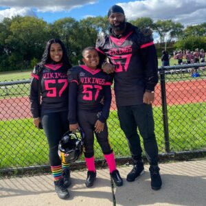 Donald Brumfield Jr. Instagram - Good job son at your homecoming game 🩷🖤 in honor of breast cancer today it’s about to get real it’s playoff time let’s go Vikes!!! 💛🖤