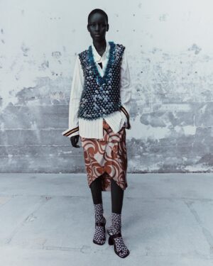 Dries Van Noten Instagram - SPRING SUMMER 2024

Biliny, look 48

Hand-embroidered sequin top.
 
Yellow and ecru striped shirt with graphic gros-grain cuff detail.

Printed silk-twill draped skirt.
 
All-over printed tabi socks.

Toe ring sandals in calf leather with laces to knot around ankles.

#DriesVanNoten #DVNSS24
