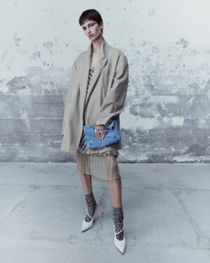 Dries Van Noten Instagram - SPRING SUMMER 2024

Maud wears look 53

Oversized double breasted blazer

Loose fit double layer slip dress with bicolor printed checks and embroidered hem

Washed denim handbag

Set of open rings with pearl embellishment

Printed cotton socks

Slingback pump with front strap and buckle detail

#DriesVanNoten #DVNSS24