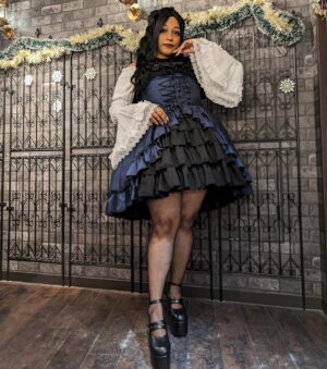 Ebony Bowens Instagram - Thank you so much @atelier_pierrot @atelier_pierrot_english for having me model the Bustle Corset JSK ♥️ Really liked how these photos came out! I can’t decide which color I like the best! モデルさせていただきました🤍　ありがとうございました！🥀

The Japanese elegant gothic lolita fashion community usually doesn’t see someone like me representing brand clothing for lolita. As someone who’s loved egl fashion for almost 20 years, I cannot tell you how proud I am to be a full figured, plus size, thicc, whatever adjective you like to use (lol) black woman modeling for a lolita brand in Japan. This is the type of representation I would’ve loved to see as a child, but sometimes you gotta be the change you wanna see! 💕

Thank you to all the hardworking Japanese and non-Japanese staff at Atelier Pierrot for making the investment and effort to produce high quality lolita fashion clothing in plus sizes. Egl should be for everyone to enjoy regardless of size, race, gender, height, etc. They are taking small steps everyday in the right direction 🖤

#eglcommunity #eglcoord #eglfashion #gothlolita #atelierpierrot #atelierpierrot_style #blacklolita #plussizelolita #harajukufashion #kawaiifashion #jfashion #ロリータ #ロリィタ #ゴシックロリータ #プラスサイズロリータ　#プラスサイズロリィタ #アトリエピエロ