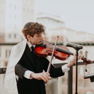 Eden Riegel Instagram - So… this happened. Still processing. We are beyond proud of this amazing kid. He worked so hard (without having to be reminded once!) and was actively involved in planning even small details of his Bar Mitzvah. He learned Hebrew for the first time, and read his portion, sang, and recited numerous prayers beautifully, with characteristic polish and panache. He even accompanied the service on Viola at times, and arranged his parts by ear. (Thanks to @jenniyael and @brandonemusic!) To witness my child coming of age is a blessing. He was (is) magnificent and our hearts so full!

Photos by the incredible @thelittlealli 
Thank you to Cantor Rebekah Mirsky @rebekahmirsky for the beautiful service and guidance!