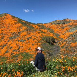 Emily Coutts Instagram - He wanted to hike to the top of the tallest peak. I wasn’t sure he’d be able to but I thought, why not try. We forged a winding path, committed to not hurting a single poppy on the way. We arrived at the peak and sat down for a break. I asked him if he wanted to listen to a meditation about change and letting go, I thought we both could use it. We closed our eyes and listened for 15 minutes, feeling the breeze. When we gently opened our eyes we were surrounded not only by poppies and warm breeze but by hundreds of butterflies dancing around us. We looked at each other, started to smile then laugh. What magic. I will never forget that moment. And now I will picture him there, smiling back at me. Transforming like the butterfly. 

I love you Ken. Rest in peace 🖖🏼