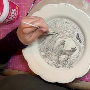 Emily Gravett Instagram - A bit of colbalt oxiding. I’ve not used it on green ware before so it’ll be interesting to see how it turns out.
I’ve still not decided on what to do with the border though.
Any ideas?  #potterylove #porcelain #handmade