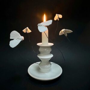 Emily Gravett Instagram - I tried a new thing the other week. I made a candle holder! 
I’ve just finished a book (a Pete the badger book!) involving drawing a LOT of insects.  I think it’s rubbed off in my ceramics
#potterylove #handmade #pottery #ceramicsart #moths #mothtotheflame #porcelain #paper #clay #paperclay