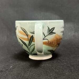 Emily Gravett Instagram - I really wasn’t sure how this would work. If the fish would be visible, whether the greens would shade down in the way I wanted, so I’m pretty delighted with how it turned out.  #ceramicsart #potterylove #porcelain #outofthekiln #teacupandsaucer