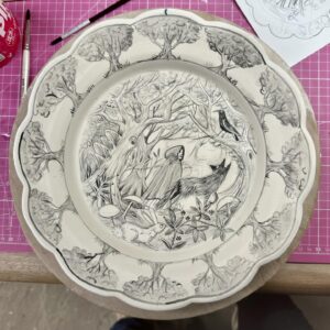 Emily Gravett Instagram - Thanks for all the brilliant suggestions of what to put around the border. I decided to keep it simple in the end and surrounded them with some more trees.
I’m thinking of attempting to fire this vertically in the kiln- I’m a bit scared!
#potterylove #porcelain #handmade #ceramicsart #fairytaleonaplate #littleredridinghood #ceramics #wolf