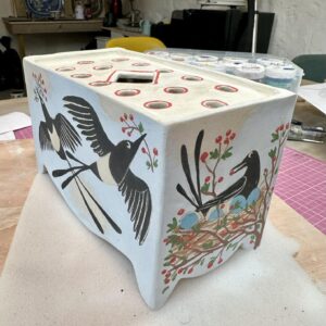 Emily Gravett Instagram - I’ve been playing with some new things. I’ve got this flower brick drying out on the shelf. 
It’ll have to stay there for a while now as I’m off away for work for a few weeks.
I’m going to miss my studio

#ceramicsart #porcelain #handmade #magpiesofinstagram #flowerbrick