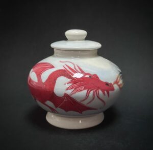 Emily Gravett Instagram - I really struggle with controlling the finished shape of the pots I throw. My skill is definitely more in the decoration side, but I LOVE making things and am happy to try and fail. I was absolutely DELIGHTED when I managed to make this moon shaped dragon jar after a million attempts. My concentration face was Badddddd…
My pride was cut a bit short when my other half asked if it was an urn for a hamster. 
Maybe I need to work on the size next

Anyway- I will be putting this little jar and my ‘Night Owl’ candle holder into my online shop this Saturday (11th) at 7pm GMT