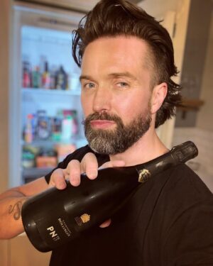 Emmett Scanlan Instagram - Sporting a mullet on my head & a bottle of fizz in my hand; April started with a bang….Whatever your poison my friends, keep her chilled, keep on popping & always restockin!!! #Gratitude 🙏🏻🎥👊🏻🍾