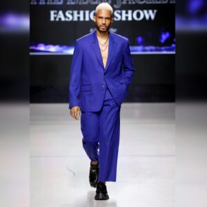 Eric West Instagram - Affairs of the heart…. Thank you to @bluejacketfashionshow for having me be part of this amazing cause once again. #BlueJacketFashionShow

Outfit: @teddyvonranson 
All jewelry: @titleofwork 
Shoes: @prada 

Hair: @deiby.barber26 / @enriques_barbershop_salon 
Grooming: @nadiamezabeauty @monique_marquerite 

Quick thanks to the entire time for getting me in this outfit a few minutes before the runway and holding me down backstage! 💙❤️‍🔥