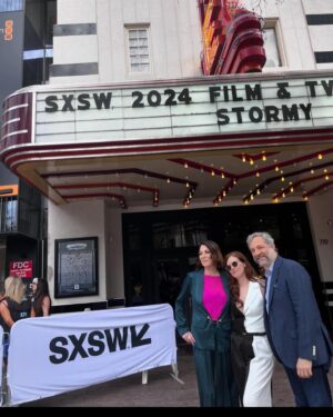 Erin Lee Carr Instagram - AHHH we did it!!!! #Stormy successfully and safely (phew) premiered at @sxsw with Stormy taking the stage to embrace @sarah_silverlake after the film played. it’s an emotional, intense thing to bear witness to all that Stormy has gone though let alone to be her and watch this movie in front of a live audience.
I’m endlessly grateful to @juddapatow for taking this project on and loving it like one of his own films. He (and his wonderful #2 @oliviarosenbloom) pushed us to investigate harder, be braver and yes make the film longer. And although it’s mostly us cheesin (see our incredible producers @sarabdocs @meredithkaulfers @ericaforstadt @steelesds) this film took an absolutely village.
Editors: @inballessner @cutestboyben 
Incredible producer not pictured: Emelia Brown
Supervising Producer: Amanda Rohlke
Co-Producers: @jasonsager, 
Brooke Gadinsky-Snyder, Natalie Goldberg, @oliviarosenbloom 
Composed music: Jeff Marrow
Co-exec producer: Kelsey Field
Story Producer: Jono Zalay 
Archive Producer Extrodinaire: Leah Lani-Griffin 
Cinematography: @shihofukada, Jonathan Furmanski, @wolfganghammer @barrettblade777 
Editorial Consultant: @mbonfiglio2000 
Lead Assistant editor: Moriah Dobos

but only made possible by director @sarah_silverlake 
with love, grit and determination for @thestormydaniels 
On @peacock 3/18

Suit: @aliceandolivia 
Belt: @gucci 
Hair:  Jessica Lindsay (and extensions by @extensionbarla)
Make-Up: Caitlin Krenz 
Accompanied by my prince @malblum