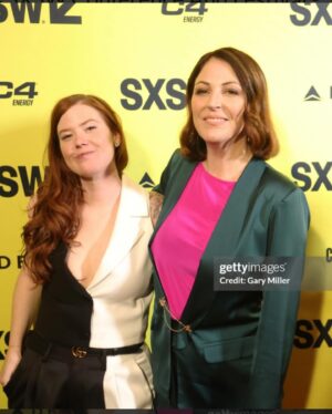 Erin Lee Carr Instagram - AHHH we did it!!!! #Stormy successfully and safely (phew) premiered at @sxsw with Stormy taking the stage to embrace @sarah_silverlake after the film played. it’s an emotional, intense thing to bear witness to all that Stormy has gone though let alone to be her and watch this movie in front of a live audience.
I’m endlessly grateful to @juddapatow for taking this project on and loving it like one of his own films. He (and his wonderful #2 @oliviarosenbloom) pushed us to investigate harder, be braver and yes make the film longer. And although it’s mostly us cheesin (see our incredible producers @sarabdocs @meredithkaulfers @ericaforstadt @steelesds) this film took an absolutely village.
Editors: @inballessner @cutestboyben 
Incredible producer not pictured: Emelia Brown
Supervising Producer: Amanda Rohlke
Co-Producers: @jasonsager, 
Brooke Gadinsky-Snyder, Natalie Goldberg, @oliviarosenbloom 
Composed music: Jeff Marrow
Co-exec producer: Kelsey Field
Story Producer: Jono Zalay 
Archive Producer Extrodinaire: Leah Lani-Griffin 
Cinematography: @shihofukada, Jonathan Furmanski, @wolfganghammer @barrettblade777 
Editorial Consultant: @mbonfiglio2000 
Lead Assistant editor: Moriah Dobos

but only made possible by director @sarah_silverlake 
with love, grit and determination for @thestormydaniels 
On @peacock 3/18

Suit: @aliceandolivia 
Belt: @gucci 
Hair:  Jessica Lindsay (and extensions by @extensionbarla)
Make-Up: Caitlin Krenz 
Accompanied by my prince @malblum