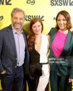 Erin Lee Carr Instagram - AHHH we did it!!!! #Stormy successfully and safely (phew) premiered at @sxsw with Stormy taking the stage to embrace @sarah_silverlake after the film played. it’s an emotional, intense thing to bear witness to all that Stormy has gone though let alone to be her and watch this movie in front of a live audience.
I’m endlessly grateful to @juddapatow for taking this project on and loving it like one of his own films. He (and his wonderful #2 @oliviarosenbloom) pushed us to investigate harder, be braver and yes make the film longer. And although it’s mostly us cheesin (see our incredible producers @sarabdocs @meredithkaulfers @ericaforstadt @steelesds) this film took an absolutely village.
Editors: @inballessner @cutestboyben 
Incredible producer not pictured: Emelia Brown
Supervising Producer: Amanda Rohlke
Co-Producers: @jasonsager, 
Brooke Gadinsky-Snyder, Natalie Goldberg, @oliviarosenbloom 
Composed music: Jeff Marrow
Co-exec producer: Kelsey Field
Story Producer: Jono Zalay 
Archive Producer Extrodinaire: Leah Lani-Griffin 
Cinematography: @shihofukada, Jonathan Furmanski, @wolfganghammer @barrettblade777 
Editorial Consultant: @mbonfiglio2000 
Lead Assistant editor: Moriah Dobos

but only made possible by director @sarah_silverlake 
with love, grit and determination for @thestormydaniels 
On @peacock 3/18

Suit: @aliceandolivia 
Belt: @gucci 
Hair:  Jessica Lindsay (and extensions by @extensionbarla)
Make-Up: Caitlin Krenz 
Accompanied by my prince @malblum