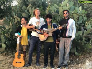 Erlend Øye Instagram - A little presentation of La Comitiva: we started in 2018, when Marco, Stefano and Luigi joined my Chilean and Argentinian tour. The tour got longer and longer, while our repertoire together grew and grew. We visited Colombia and ended in Mexico. Back in our hometown of Siracusa, Sicily, Italy, we continued playing and writing songs together. 
Here you can see clips from our music videos and some photos from the 3 years we’ve been a group. This 30th of December we will be all together again for a show at Crania, Baja California Sur, adding another exciting location to our list of places. @lacomitiva.band @maccucciu @craniareclaim @stefanoortisi @luigi_orofino