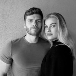 Evan Williams Instagram - A year ago I got home at 1am. I’d just met someone I couldn’t believe was on Hinge (not an ad, bubba). Couldn’t have imagined someone that beautiful inside and out showing up for a wild animal like myself yet here we are a year later and we’ve hiked with my dad in the Carolina mountains, cried laughing in a park in London, dined in Paris, she’s made Vegas seem less trashy, Germany less cold, and life happier. Our dog loves her more than me and I look at that little guy like “I get it, man”. Because when you’re loved by Sarah you feel like the luckiest idiot on the planet. She laughs hard, treats In & Out with the same excitement as a Michelin star restaurant, guesses the kiIIer correctly in every Scream film, dances like no one’s watching and treats people like everyone’s watching, unless you cut her off in traffic. God help you, brother. She’s got eyes that illuminate the dark and she’s currently rolling them while reading this and I need that too. Someone that tells me to calm down and stop talking so I’ll do that now. Happy anniversary, baby. I love you.
.
.
.
Professional photos by @shotbyfrederick
