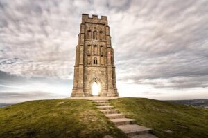 Evelyn Edwards Instagram - Glastonbury Tor... where myths, legends, and spirituality meet on the top of a hill. It’s considered to be one of the spiritual sites in England.  Deep in the hill, it was once believed, there was a cave that you could go in to and enter the realm of fairies. It was also believed that Jesus’ uncle brought the Holy Grail here.  Christ was also thought to have visited here with Joseph of Arimathea as a boy. Even the great King Arthur is thought to have visited here after his last battle and monks in Glastonbury have said they found his grave all the way back in 1191. And if you come at just the right time... you might just believe in all the magic that so many for the last 1000 years have come here to find. ⁣
.⁣
.⁣
.⁣
.⁣
.⁣
#glastonbury #glastonburytor #avalon #somerset #visitsomerset #loveforsomerset #ilovesomerset #igerssomersetuk #igersuk #bbcwest #ukpotd #gloriousbritain #photosofbritain #landscapephotography #worldtravelbook #ukscenery #priestess #kingarthur #knightsoftheroundtable #pagan #paganism #holygrail #knightstemplar #visitengland #history #travelphotography #wondersoftheworld #arthur #magick