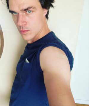 Finn Wittrock Instagram - This picture is about the Band-Aid, not the farmer’s tan. #vaxxed💉
