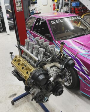 Fredric Aasbø Instagram - Aaand here’s the engine for the AE86 Corolla: A #TeamToyota 3UZ Lexus V8 on ITBs!

Some of of you guessed the motor when I first posted about the car - well done! These photos are of a first mockup and the plans are as follows:

- @kelfordcams (medium spec for good torque, factory pistons and retaining VVTi, 264 or 272 degrees duration)
- @mywireshop ultra nice custom race harness for MaxxECU, with new double TPS connectors, OBD-port, etc.
- @pmcmotorsport adapter kit and flywheel for ZF transmission
- @tenacimotorsport 240mm clutch and sprung disc for great driveability and reliability
- @xat_racing S65 ITB adapters
- Custom press fit ITB velocity stacks from my Uruguayan friend @fernandomontero_oficial
- Underdrive powersteering and alternator setup using parts from UZ mastermind @hughesracebuilt 
- @eneosusa Street 0W-50 motor oil, which is also what we run in Formula Drift

The engine itself was sourced by my friends at @garage_d_official and it’ll be fully built by my friend @dag_johnson using OEM parts from @toyota_norge. @maxxecu tuning by @jonusracing and fab work by @vtssolutions. Really excited for this build!