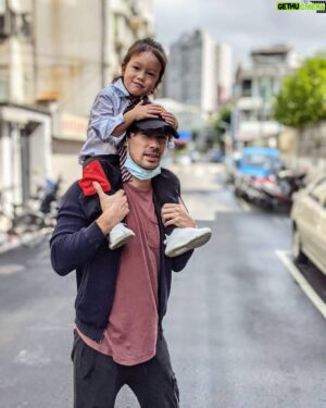 George Young Instagram - Chinese New Year's Day workout/pose off with my son. Son wins with that masculine grimace. The fact that he's wearing a tie in Taiwan is super apt I know.