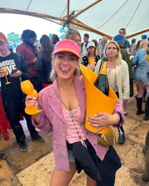 Georgie Barrat Instagram - 24 hours @wildernesshq - yes we had torrential rain & lots of muddy fields, but when you haven’t been to a festival since before Covid it was SO worth it. Outfit of course inspired by Barbie #barbiecore